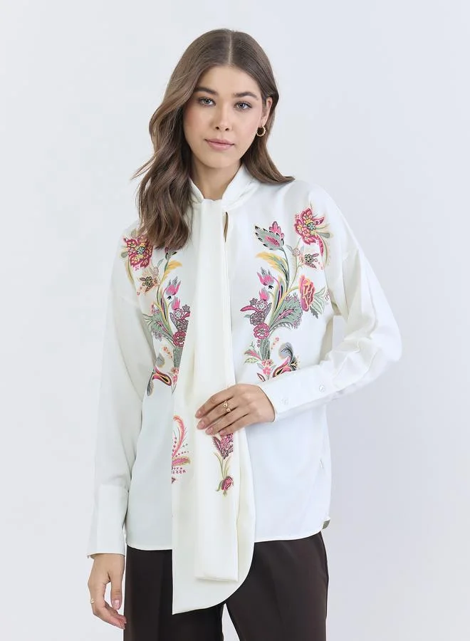 ستايلي بلوزة بقصة واسعة برباط عنق وطبعة زهور